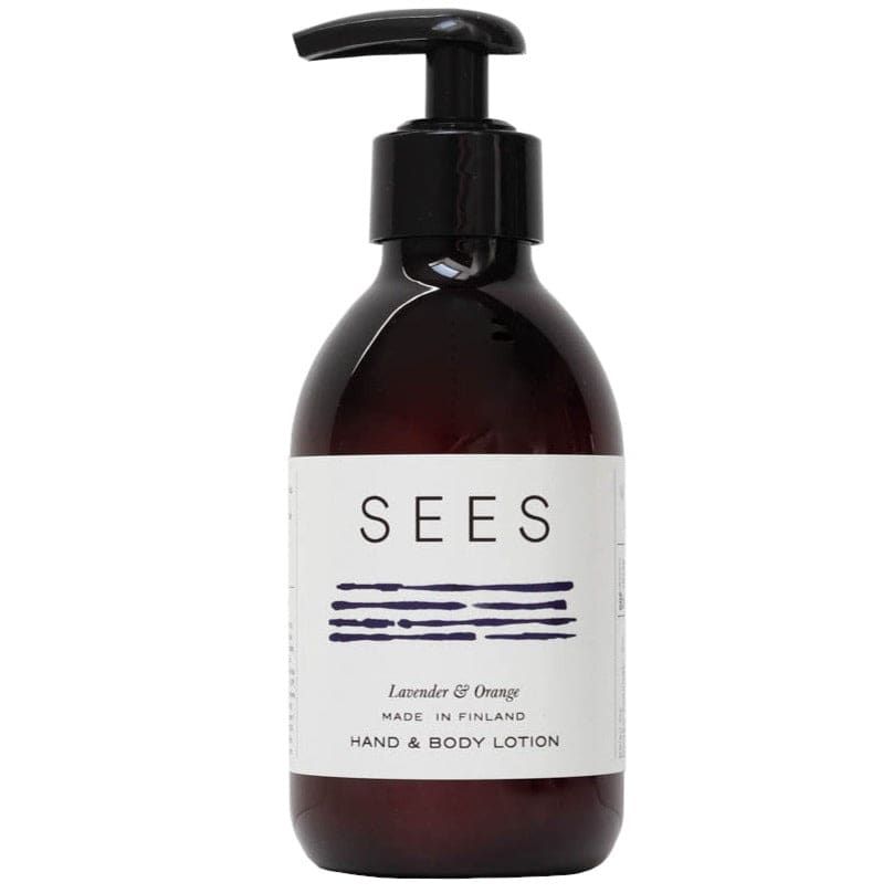 A brown pump bottle of SEES Company’s Hand & Body Lotion, featuring blue line art on a white label, combines lavender and orange scents. Made in Finland, it's part of their vegan skincare collection.