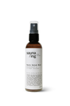 The sauna/ing Sauna Serum Mist by sauna/ing is a brown and white hydrating face spray with a black pump and clear cap, designed for post-sauna skincare.