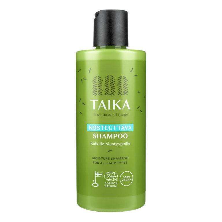 A green bottle of Taika Moisture Shampoo for all hair types, with a black flip cap and white text, features vegan and natural certification icons on its label.