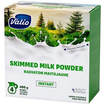 Valio Skimmed Milk Powder, 400g, comes in a green and white box featuring milk splashes and pine trees. Instantly dissolves to make 4L of high-protein milk with vitamin D, highlighting the purity of Finnish Valio milk powder.