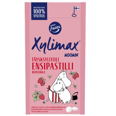 The Fazer Xylimax Moomin Strawberry Full Xylitol Pastilles package shows a Moomin character with strawberries on a pink background. The tooth-friendly candy features Finnish and Swedish text. Brand: Fazer.