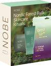 The NOBE Nordic Beauty box labeled "Nordic Forest Bath Skincare Rituals" displays a vegan Nordic skincare gift set with Forest Barefoot Balm and a Forest Elixir Microbiome Balancing Sheet Mask on a green and purple gradient background.