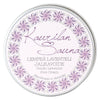A round tin labeled Kaurilan Sauna Gentle Lavender Foot Cream, handmade in Helsinki, features decorative lavender flowers around the edge and text in Finnish and English.