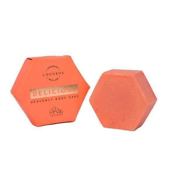 A hexagonal orange box labeled Luonkos Delicious Body Cake sits next to a matching soap bar—both by Luonkos—featuring essential oils for natural body moisturizing.