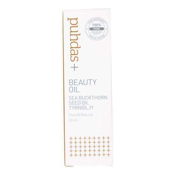 A white rectangular box of Puhdas+ Beauty Repairing Sea Buckthorn Seed Oil, a Finnish superberry product. The minimalist packaging features orange and grey text with a circular “100% pure” label in the top right corner.