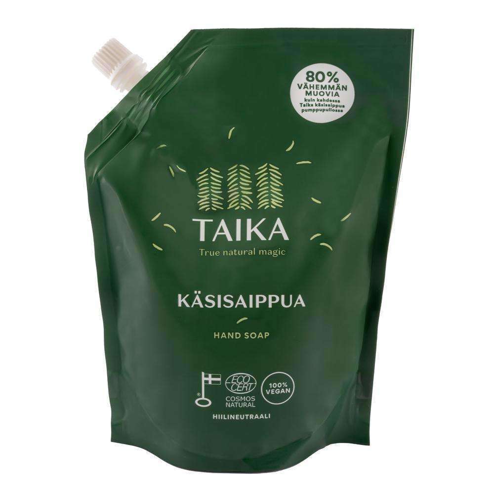A green refill pouch of Taika Liquid Hand Soap by Taika, with white text, forest design, and labels showing the gentle vegan soap is natural, carbon neutral, and uses 80% less plastic than regular packaging.