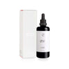 A black bottle of FLOW Cosmetics Organic Argan Oil with a dropper cap sits beside its matching white minimalist box. The label features "Organic Argan Oil" and "Lightweight Nourishment," ideal for sensitive skin. Brand: Flow Cosmetics.