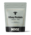 DENSE Organic Grass-Fed Whey Protein Unflavored wird in einem grau-schwarzen, wiederverschließbaren Beutel mit einem Kuhsymbol und einem goldenen Rand geliefert und enthält 500 g Protein mit hoher Bioverfügbarkeit für eine reine Ernährung.