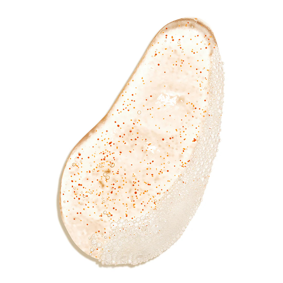 Eine Nahaufnahme des Lumene Nordic-C Clear Glow Cleansing Gel Scrub, ein klares Peeling-Gel mit winzigen orangefarbenen arktischen Moltebeer-Perlen und Bläschen, die in einem unregelmäßigen Oval auf einem weißen Hintergrund verteilt sind.