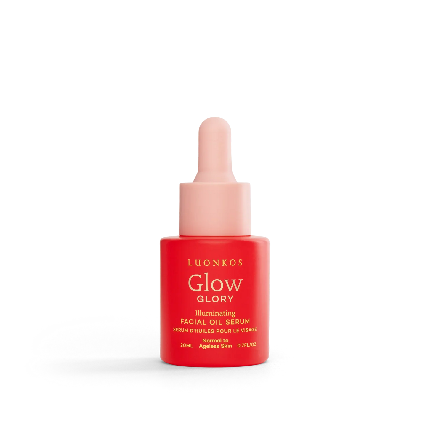 Eine rot-rosa Tropfflasche aus dem Luonkos Glow & Shine Skincare Set steht aufrecht auf weißem Hintergrund - strahlende finnische Naturkosmetik für Ihre tägliche Routine.