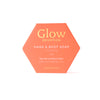 Luonkos Glow Devotion Hand & Body Soap - ein veganer Riegel für normale bis reife Haut, angereichert mit Aprikosenkernöl - bietet eine sanfte, natürliche Reinigung in der charakteristischen sechseckigen orangefarbenen Box.
