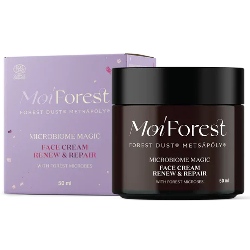 Ein dunkler 50-ml-Tiegel der Moi Forest Microbiome Magic Face Cream für empfindliche Haut steht vor der lilafarbenen Schachtel. Der Tiegel hat einen schwarzen Deckel und trägt die Aufschrift "Renew & Repair" auf dem Etikett. Marke: Moi Forest.