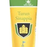 Un tubetto di senape delicata Turun Sinappi Turku con etichetta gialla e verde, stemma, bandiera finlandese e tappo nero. La confezione presenta testi in finlandese e svedese che mettono in risalto questa classica senape delicata.