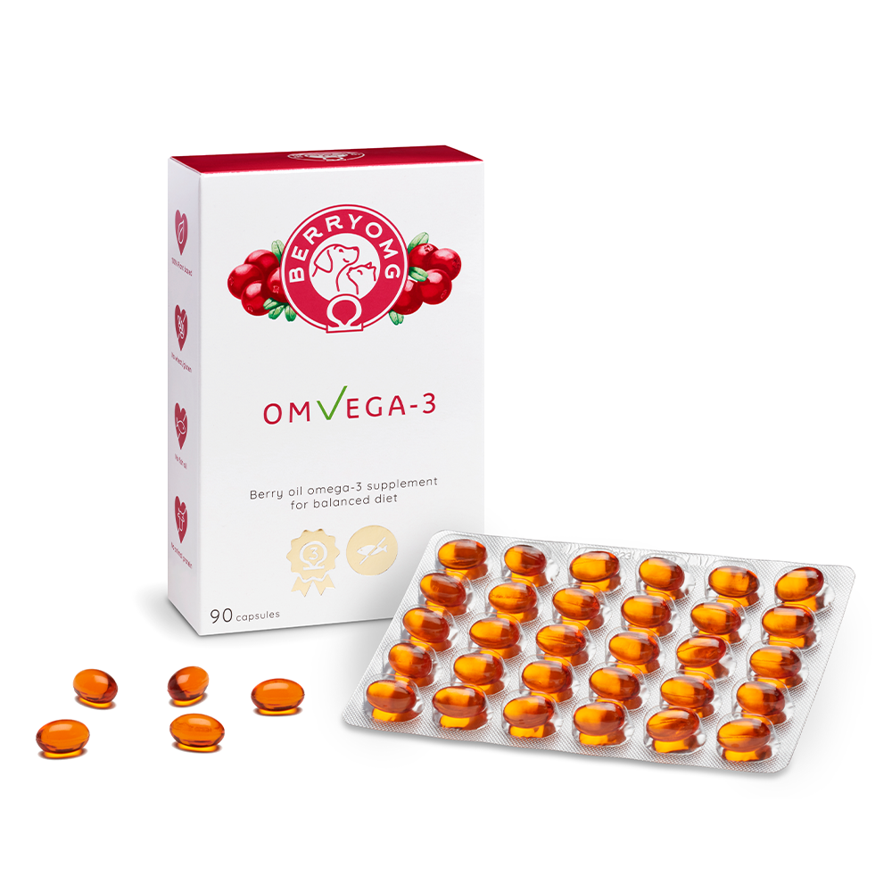 Una confezione di Berry OMG di Berry OMG accanto a un blister da 35 capsule arancioni. La confezione mostra bacche, icone Omega-3, evidenzia l'olio di semi di mirtillo rosso e indica che all'interno ci sono 90 capsule.