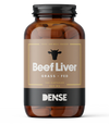 Una bottiglia marrone con l'etichetta DENSE Beef Liver by DENSE contiene 180 capsule di fegato di manzo nutrito con erba (400 mg), presenta l'icona di una testa di mucca sopra il nome e la scritta "DENSE" nella parte inferiore: integratori di organi liofilizzati di alta qualità per il benessere.