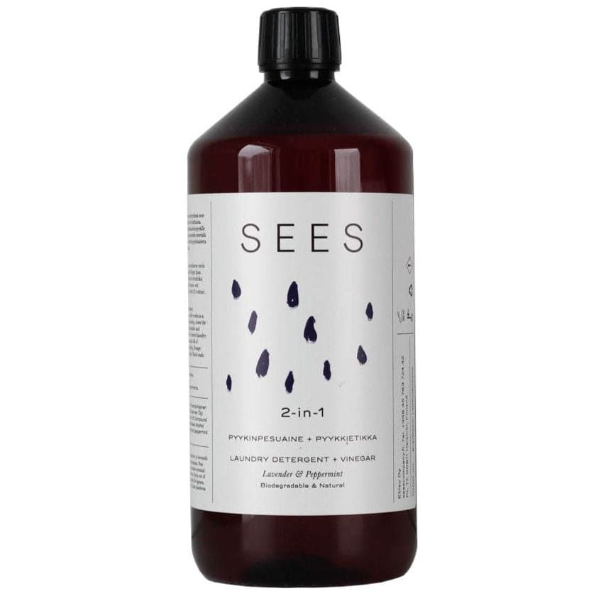 Een donkerbruine fles SEES Company wasmiddel met azijn heeft een wit etiket met zwarte druppels, waarmee de milieuvriendelijke formule en natuurlijke lavendel-pepermuntgeur voor effectieve geurverwijdering worden benadrukt.