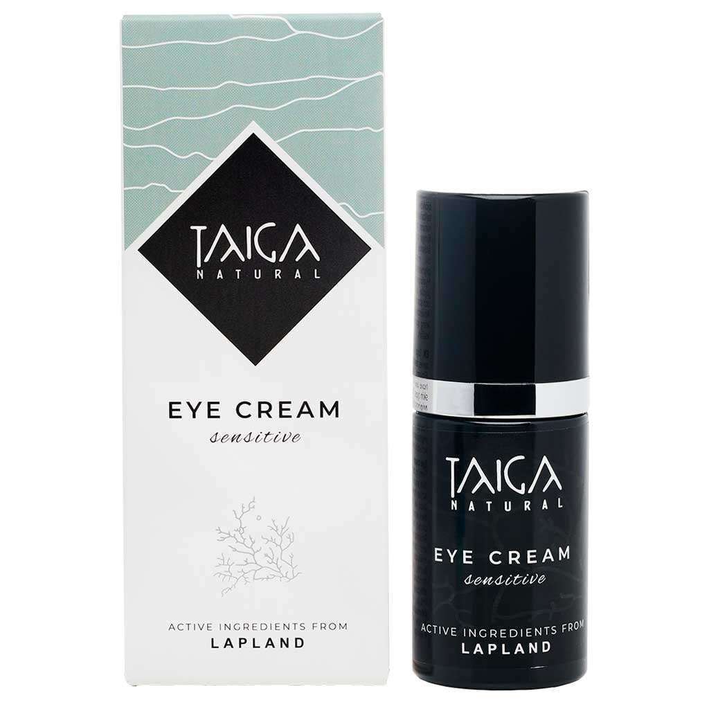 Een flesje Taiga Cosmetics Eye Cream Sensitive staat naast de doos, beide met de vermelding 'Actieve ingrediënten uit Lapland' en een minimalistisch zwart-wit ontwerp – ideaal voor de gevoelige huid en samengesteld om donkere kringen te verminderen.